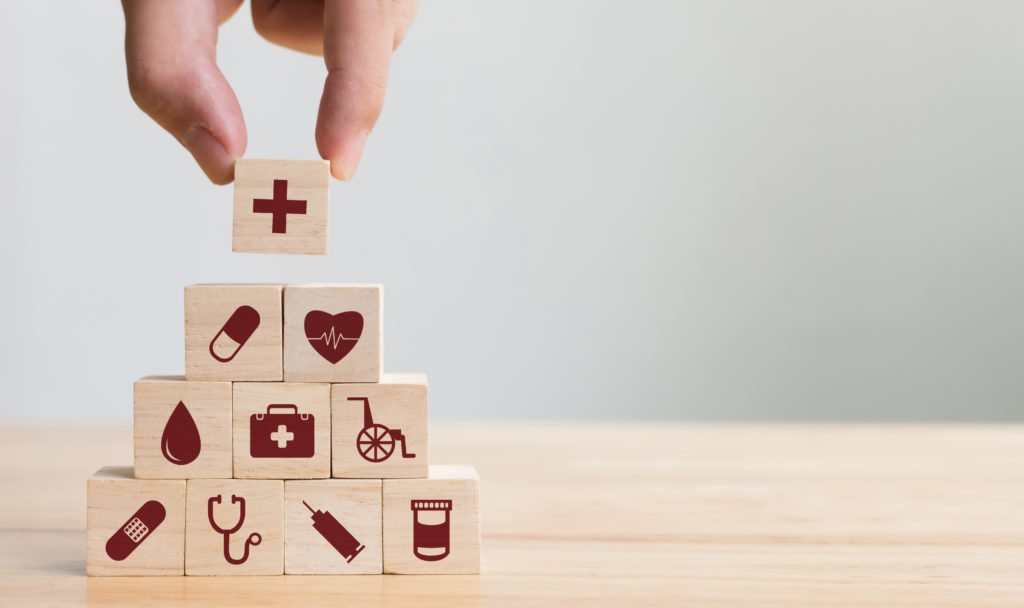 Building blocks with healthcare symbols in them