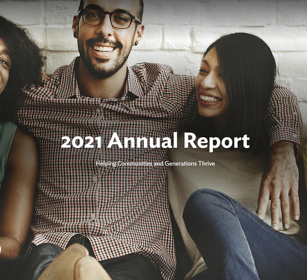 2021 Annual Report Cover with a man putting his arms around two women